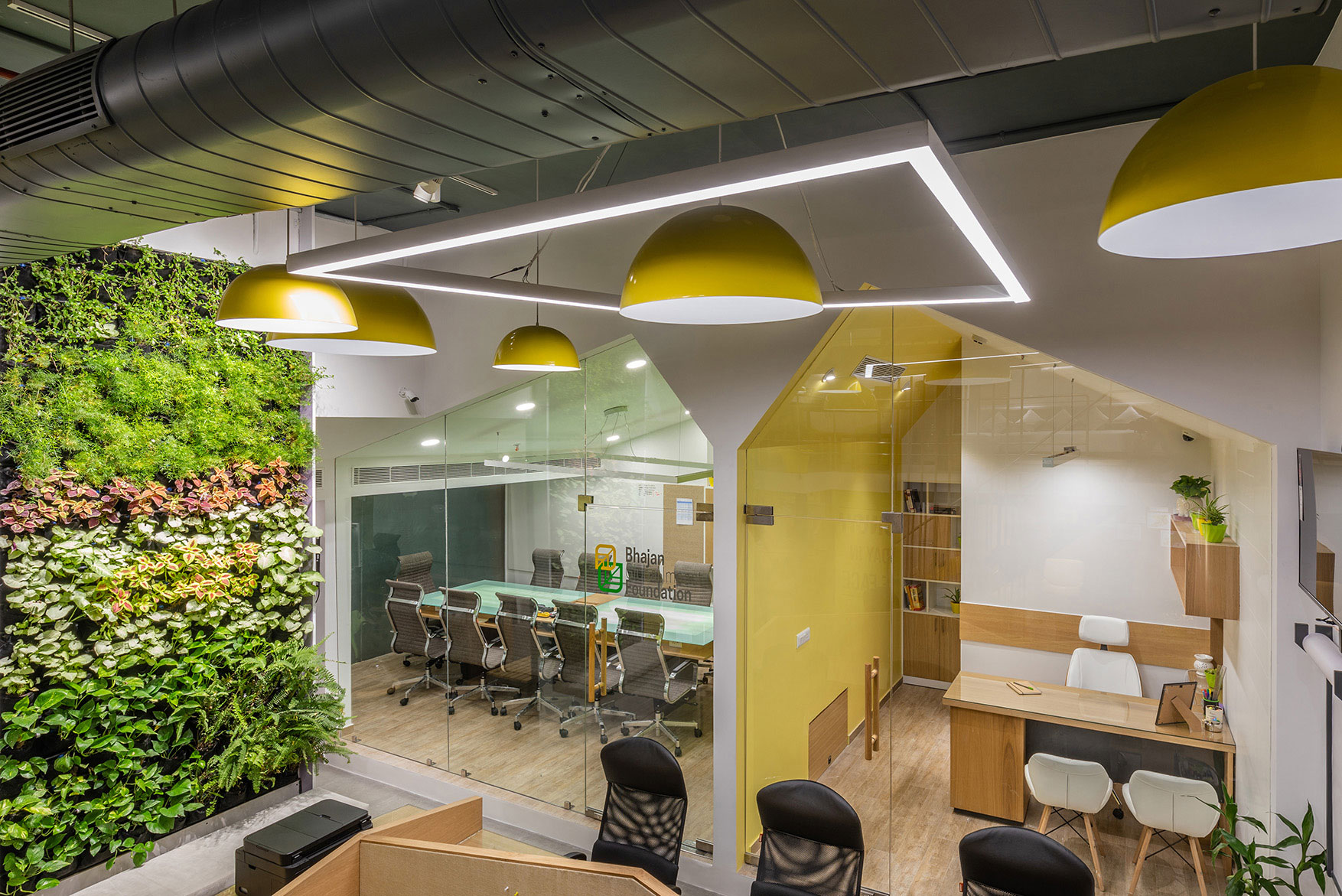 A 12 ft tall self watering automated planter wall adds life to the office