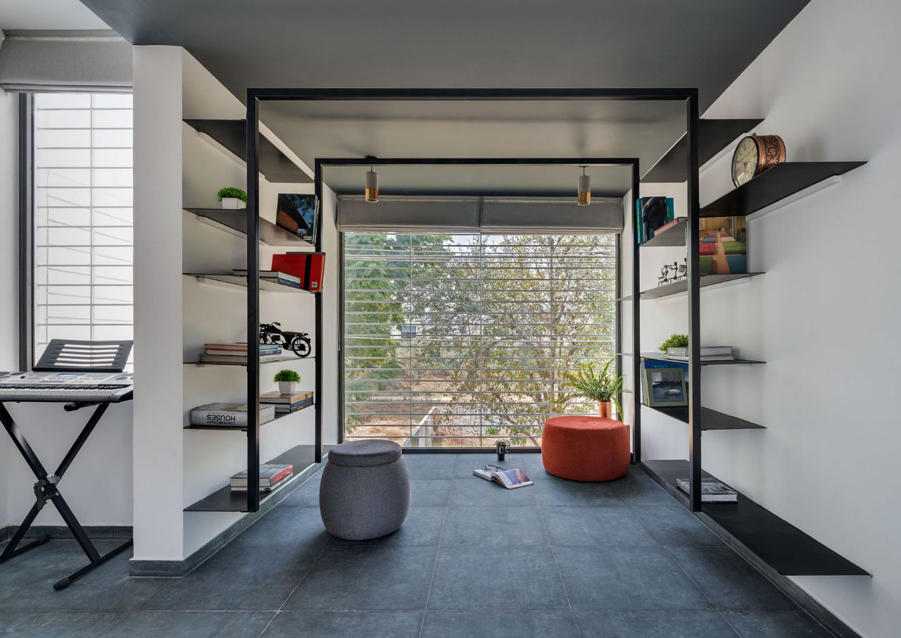 Simple fabrication for book storage in the library where a huge window lets ample amount of natural light inside.