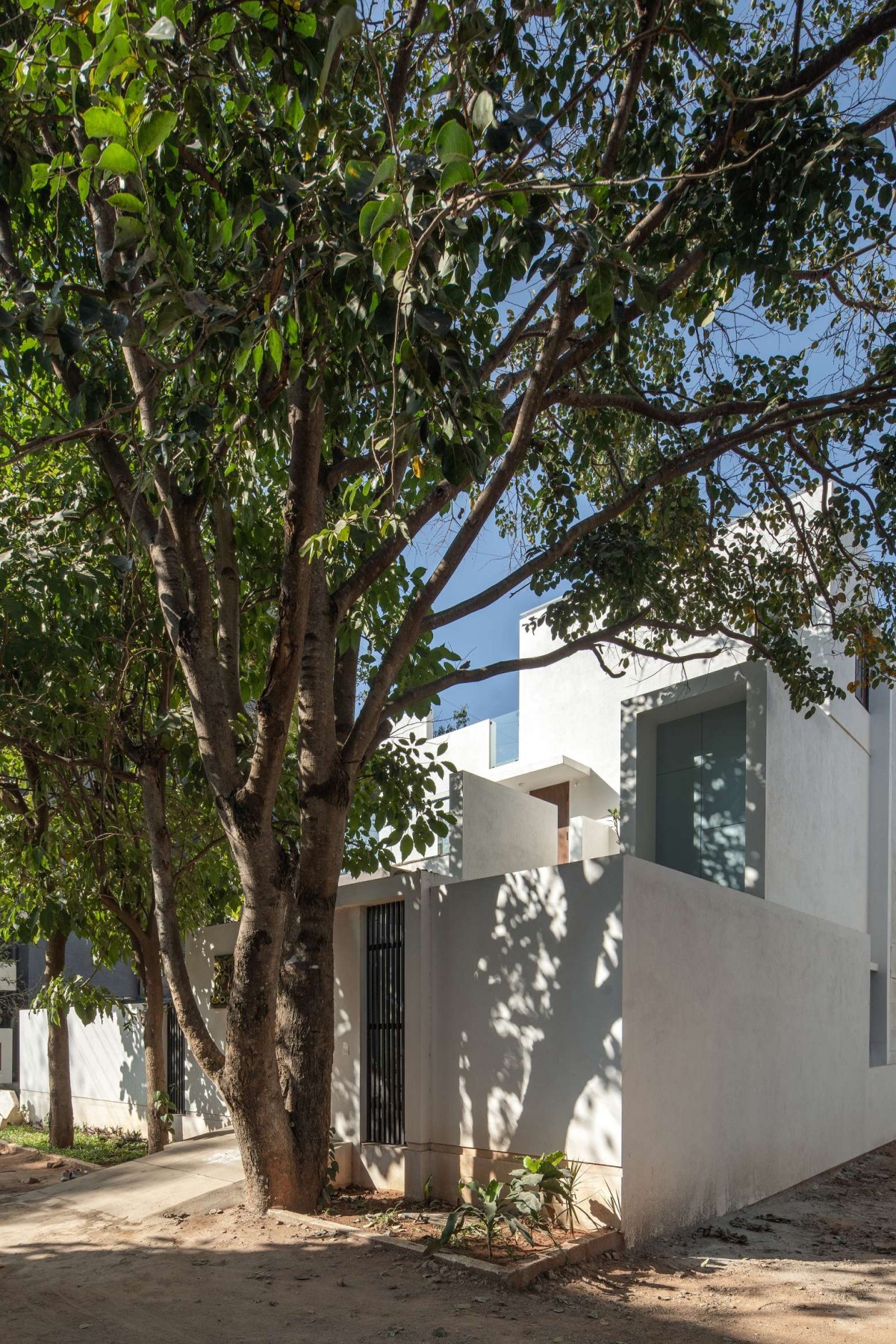 Exterior View Of House With Two Courts By Shuonya Nava Designs