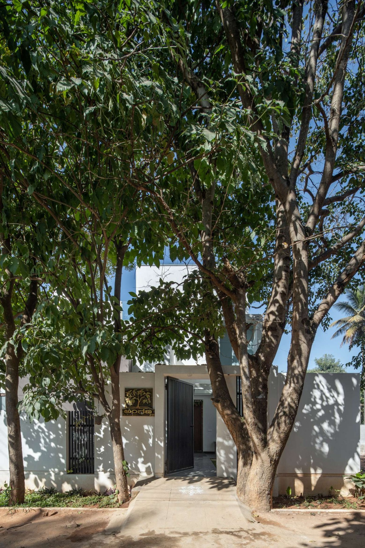 Exterior View Of House With Two Courts By Shuonya Nava Designs