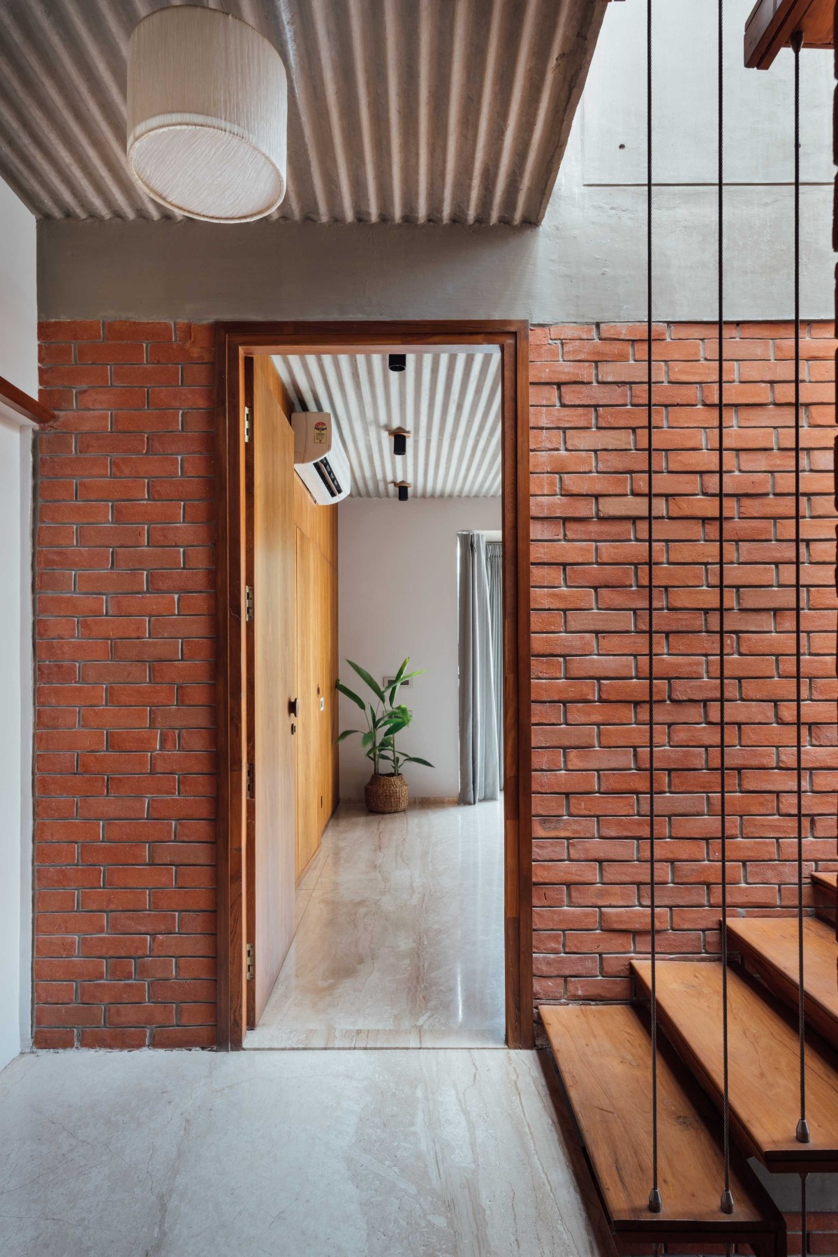 Passage and detailed shot of Nandanvan House by The Company Of Design