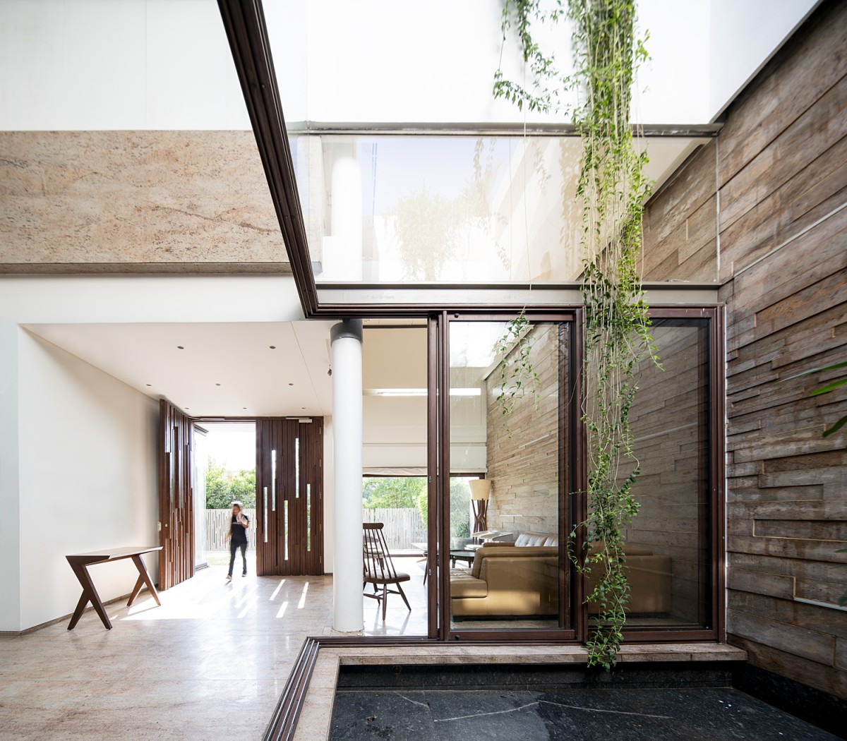 Living and courtyard view of Residence 568 by Charged Voids