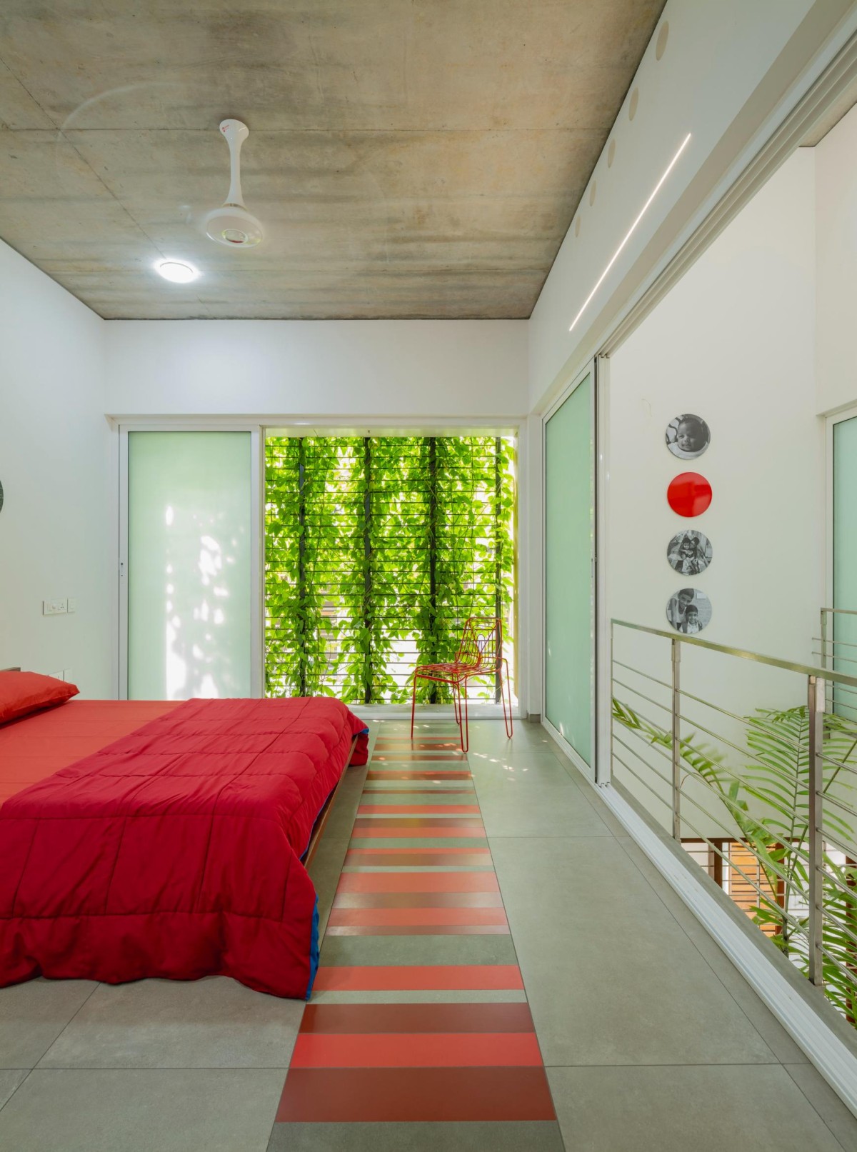 First Floor Red Bedroom of The House That Rains Light by LIJO.RENY.Architects