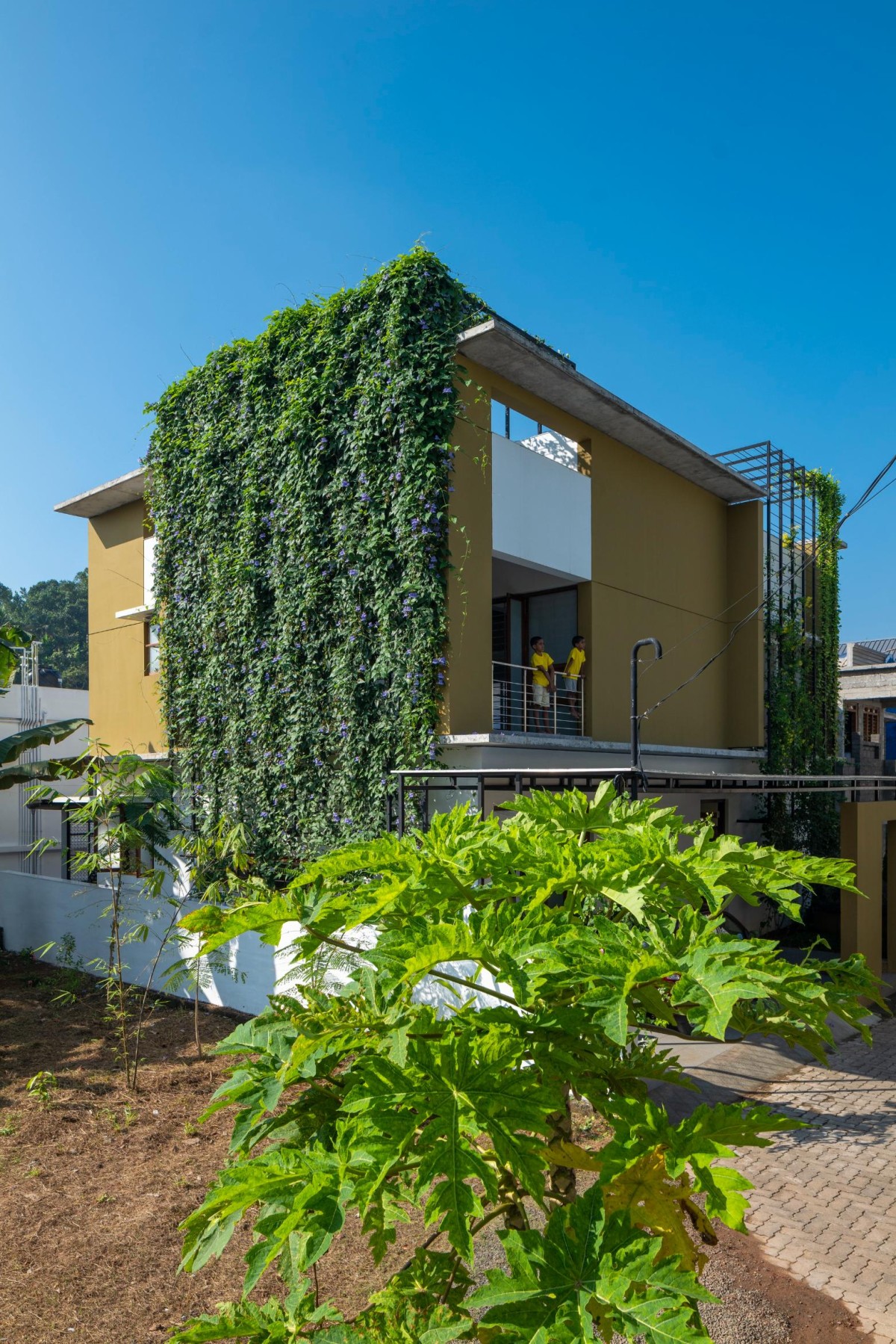 Exterior view of The House That Rains Light by LIJO.RENY.Architects