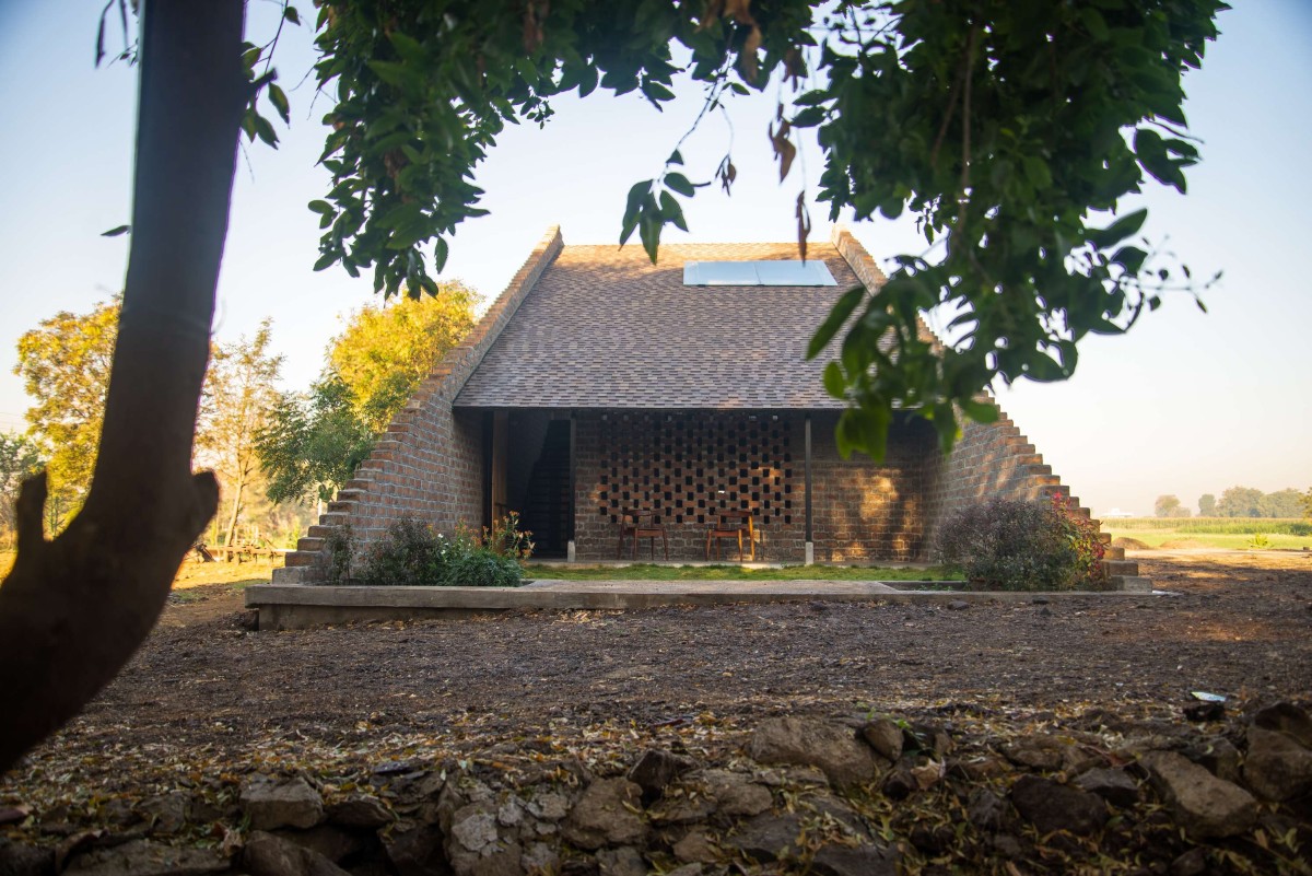 Exterior view of Half Is More – House in Progress by Atelier Shantanu Autade + Studio Boxx