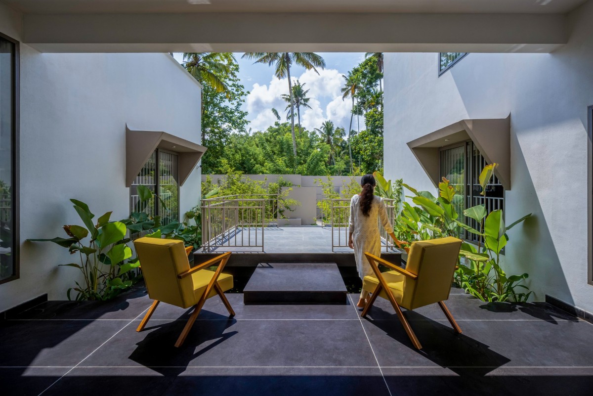 Outdoor seating of Red Wall Residence by i2a Architects Studio