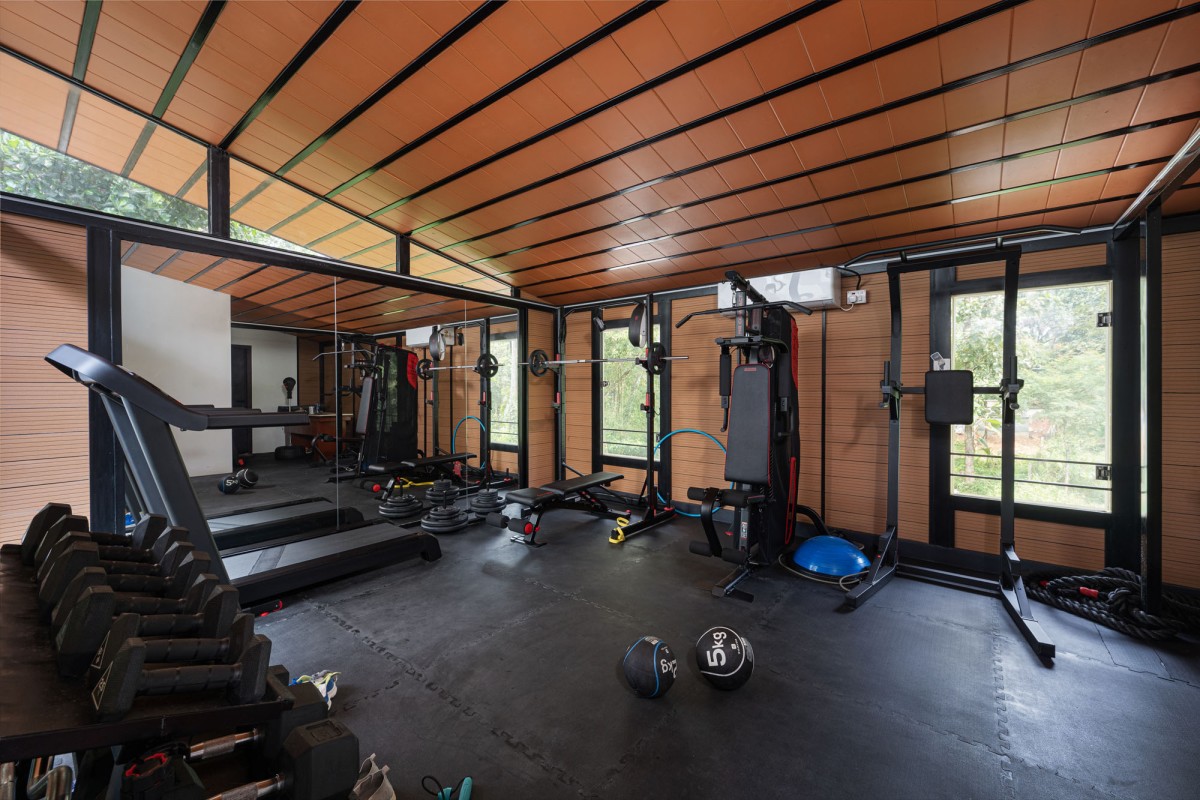 Gym of The Frangipani House by Designature Architects