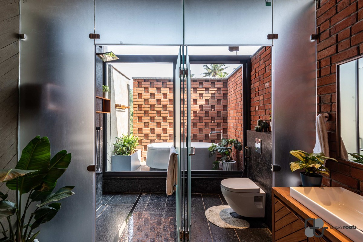 Toilet and Bathroom of Blurring the Boundaries Weekend Home at Maale by Studio Roots