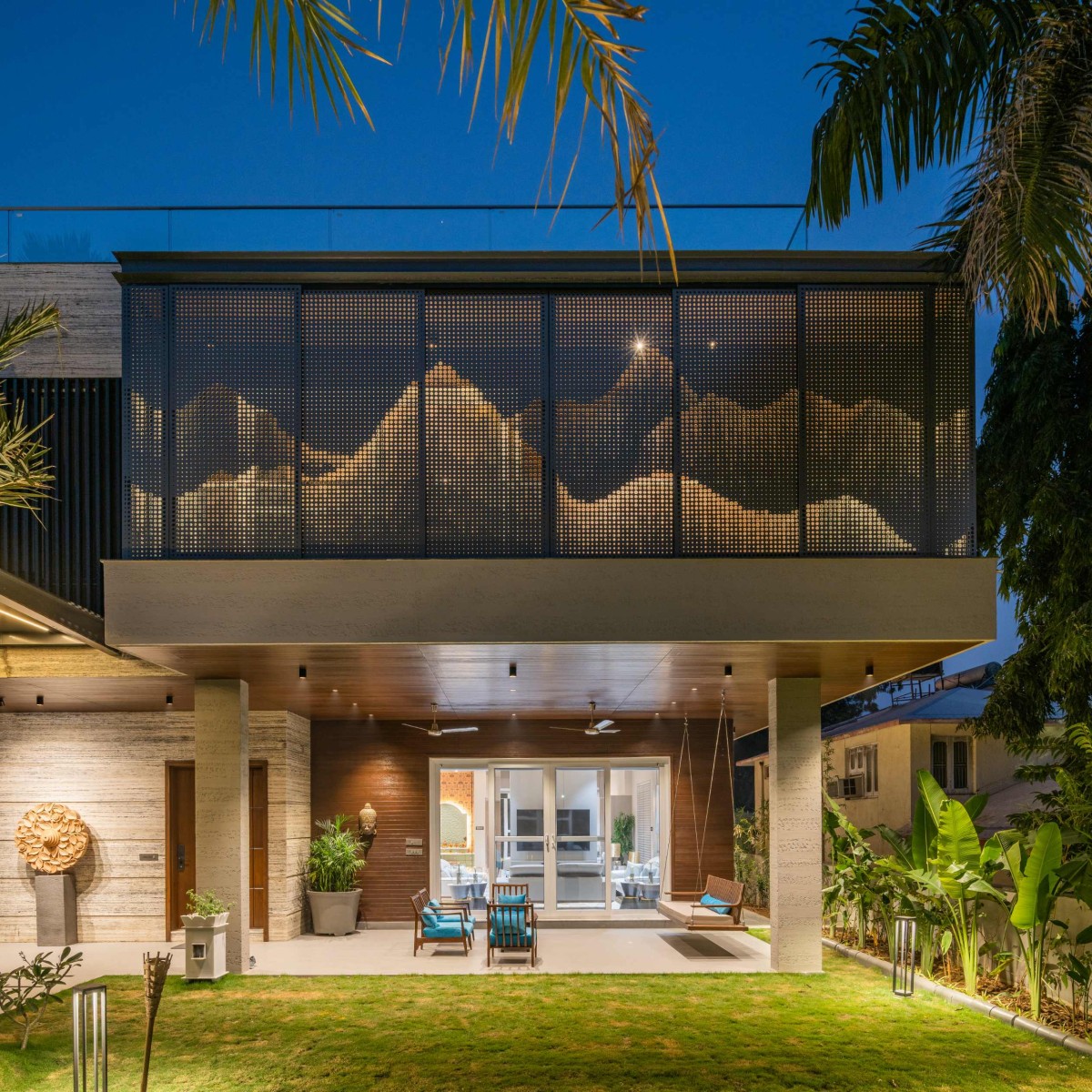 Night shot of exterior view of Vithalesh Residence by Ace Associates