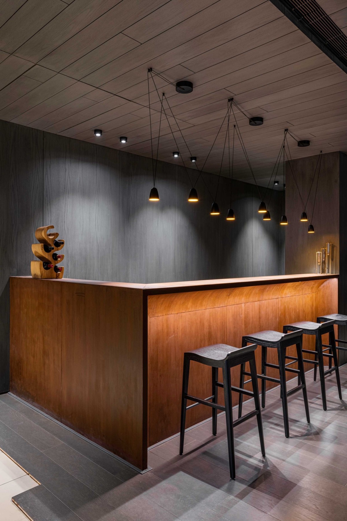 Corten steel finished bar counter of House Of Greys by ADND