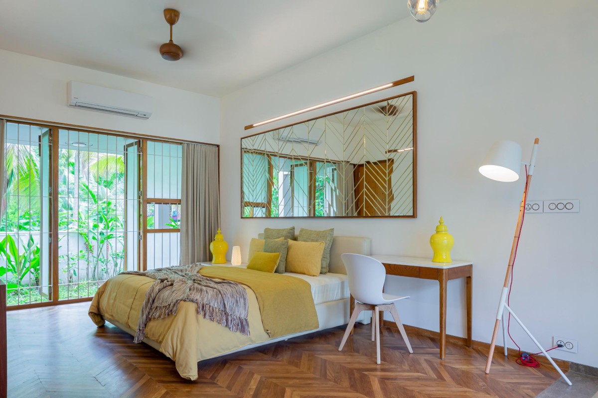 Bedroom (Yellow) of The House Within the Grid by LIJO.RENY.architects