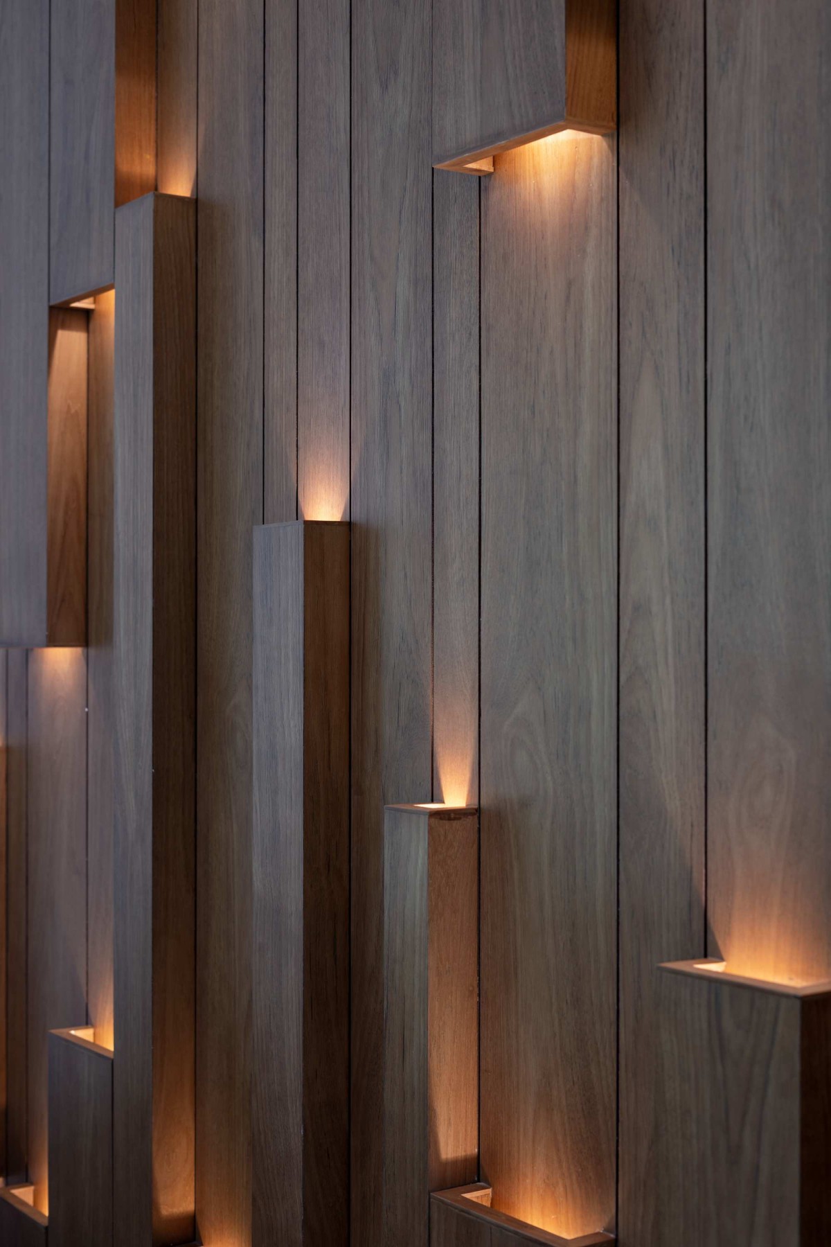 Detailed shot of wall lights at formal living room of Kurumpil Gardens by Nature’s Craft Architectural Studio