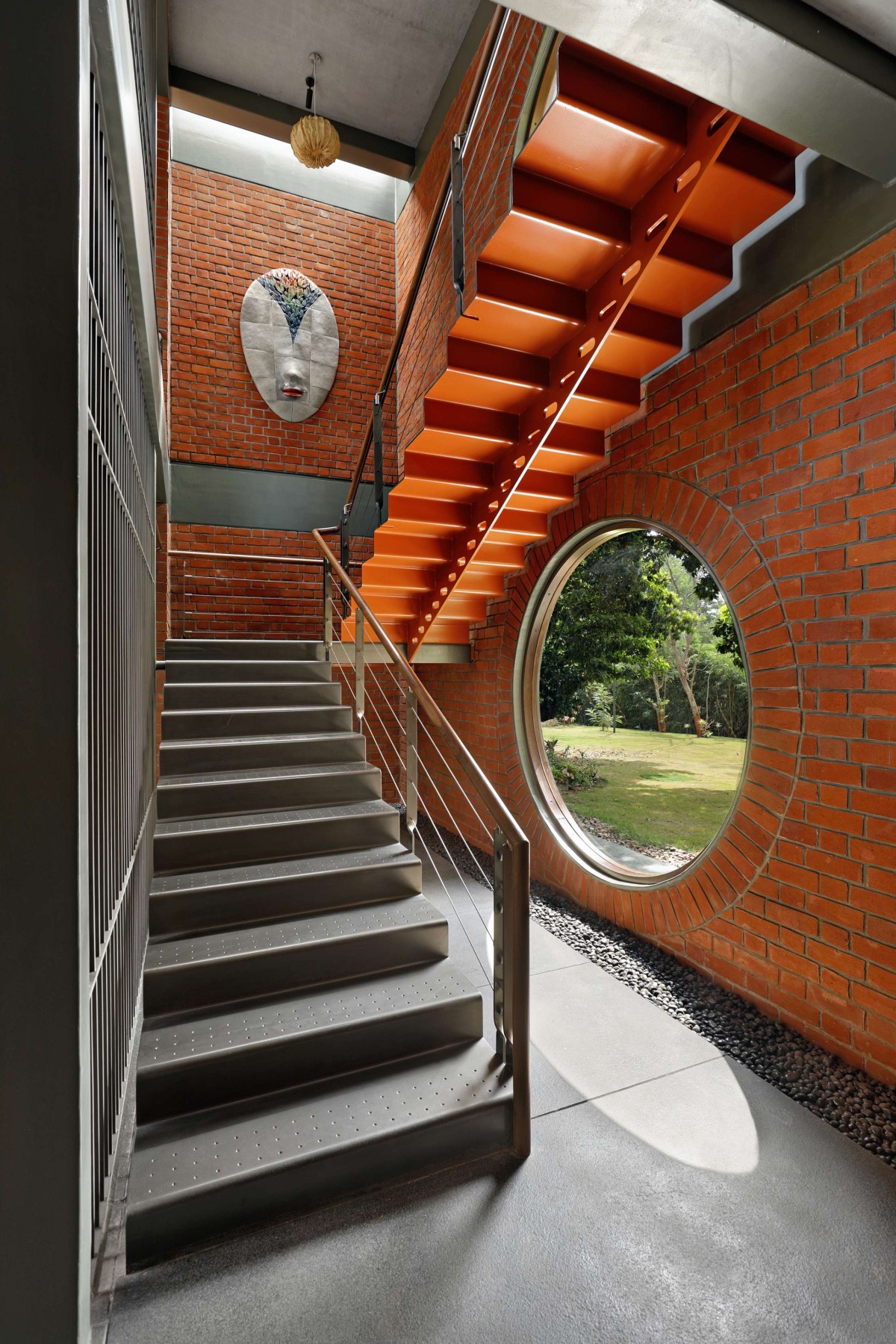 Staircase to first floor of Nirmal Farmhouse by Dipen Gada & Associates