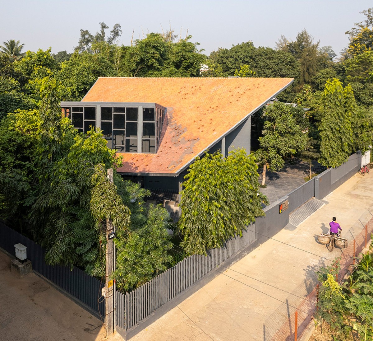 Exterior view of Arthshila – A Cultural Adaptation Re-using Private Infrastructure by Abin Design Studio