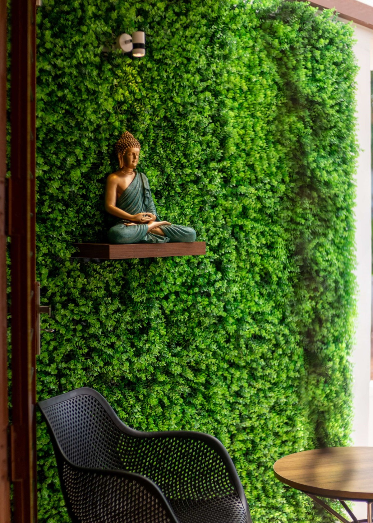 Seating area and Lord Buddha Statue of Vrindavanam by Stria Architects