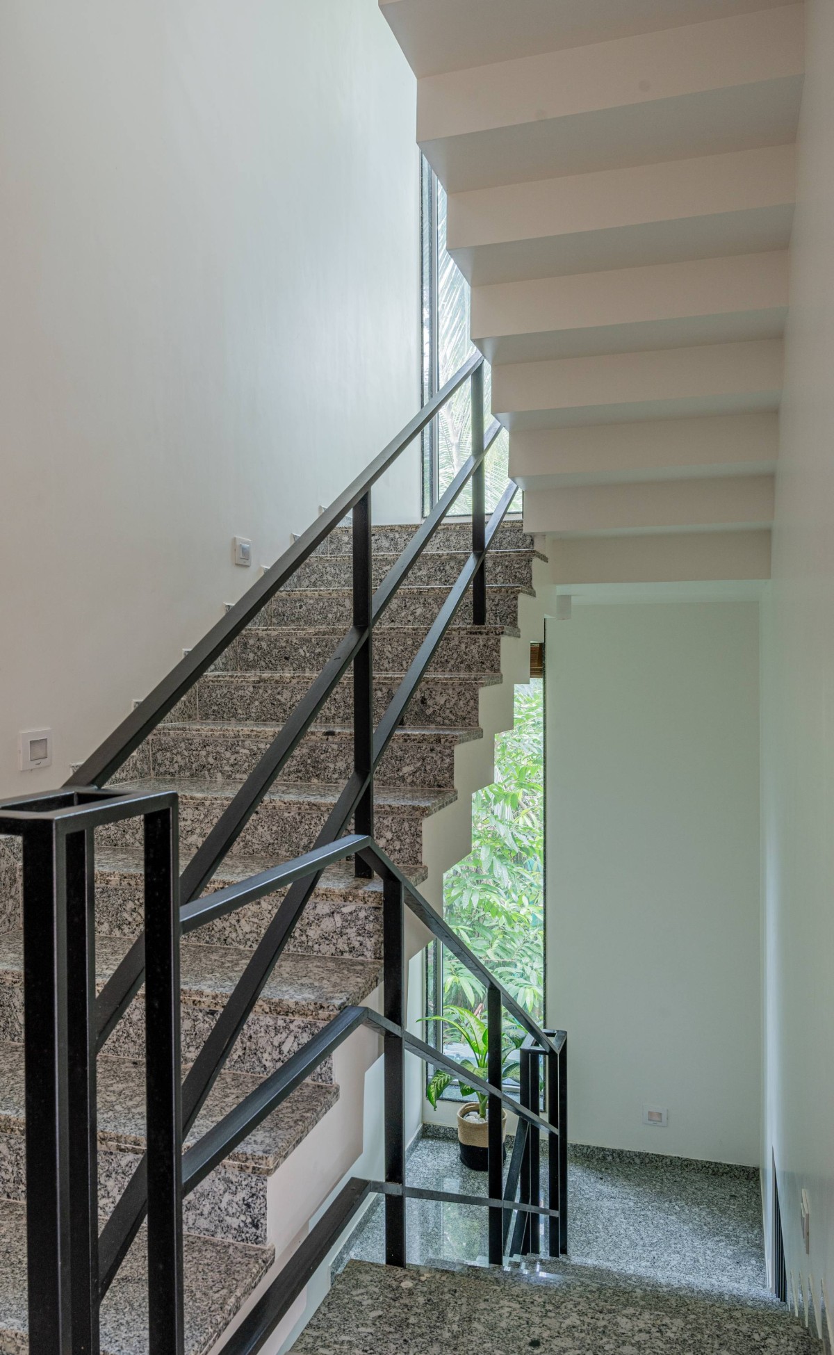 Staircase with slit window detail of Sukoon by the Subtle Studio