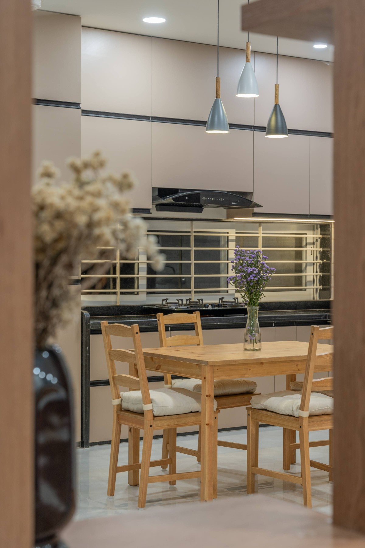 View of kitchen and Dining area though foyer screen of Sukoon by the Subtle Studio