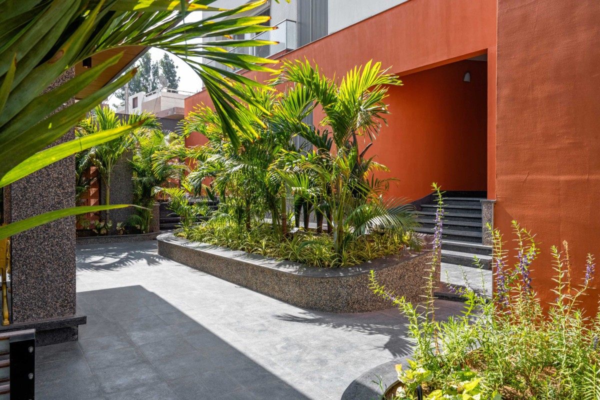 Passage to outdoor gazebo of Shreekunj Bungalows by Shraddha Architects