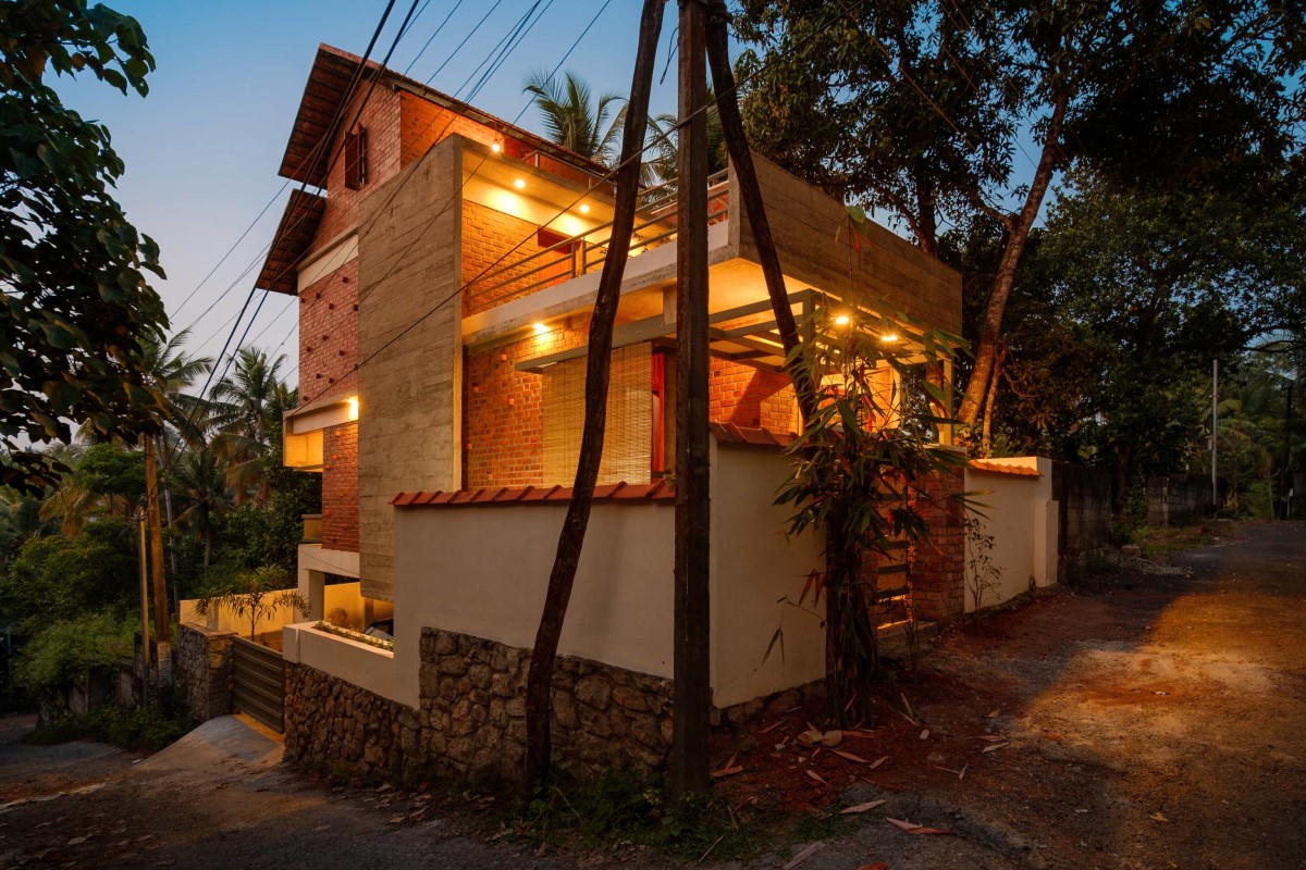 Dusk light exterior view of Idam- A house that calls back by Ishtika Design Studio