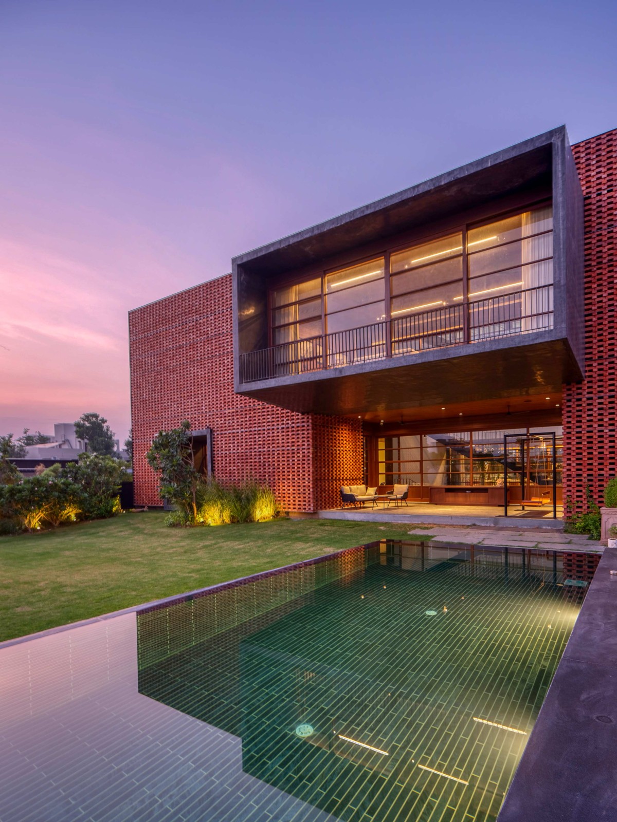 Dusk light exterior view of Ishtika House by SPASM Design Architects