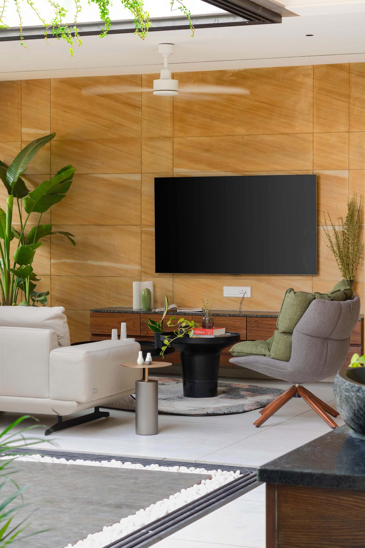 Living room of The Stone House by One Habitat Studio