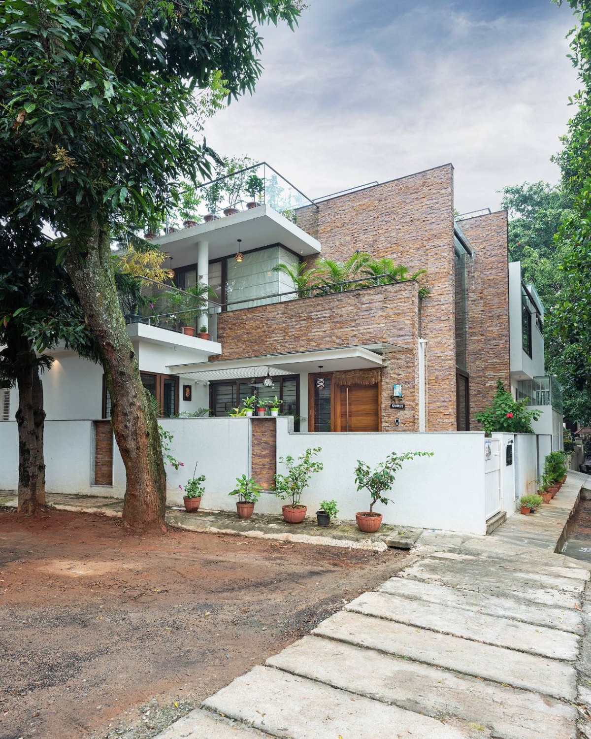 Exterior view of Twin Courtyard House by ID+AS Architects