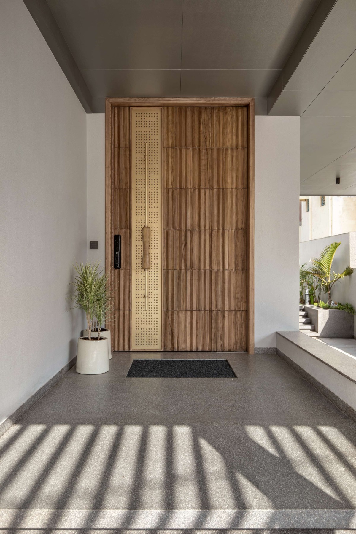 Entrance of 16 Screens House by A+T Associates