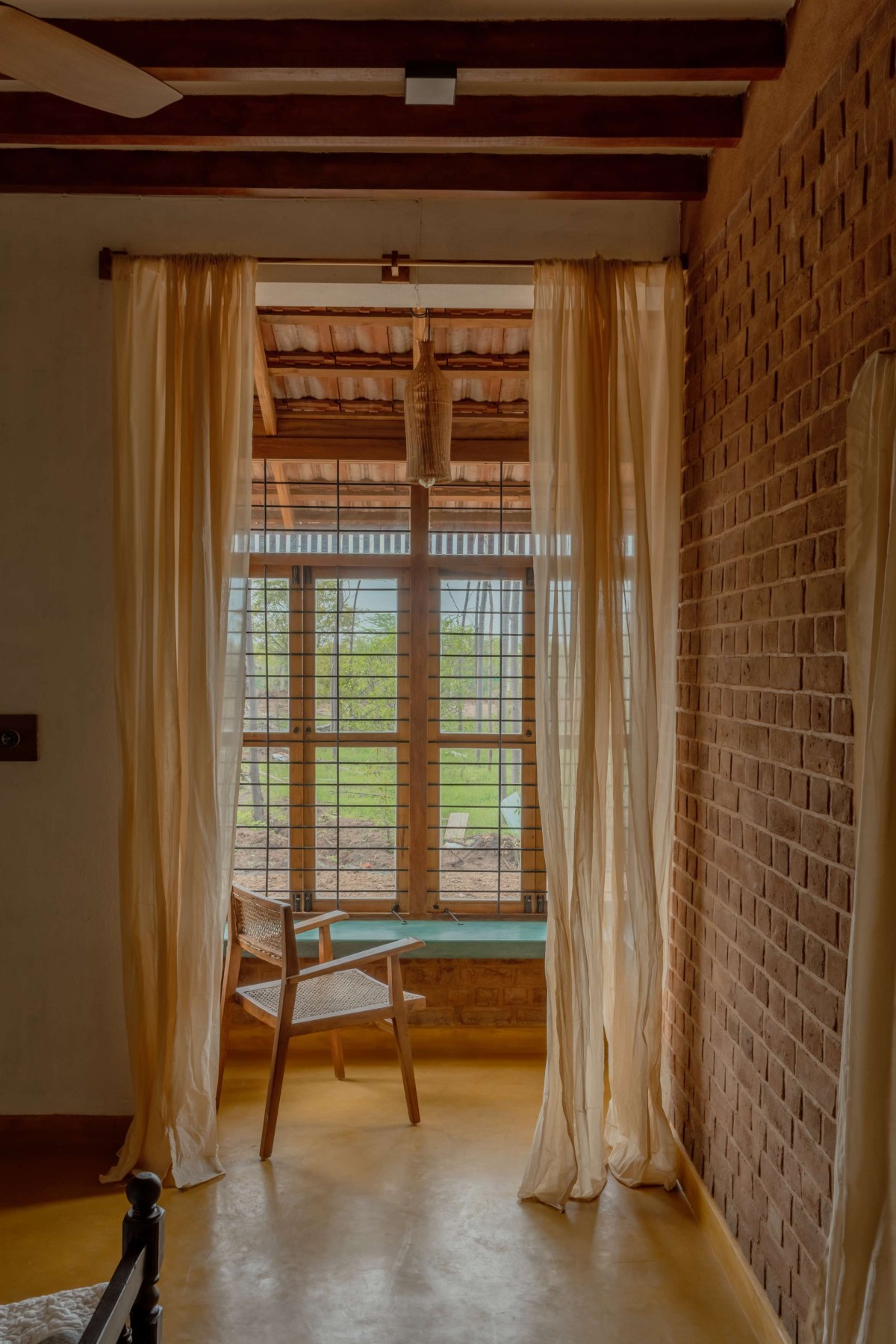 Bedroom of Brick Manor by Bhutha Earthen Architecture Studio