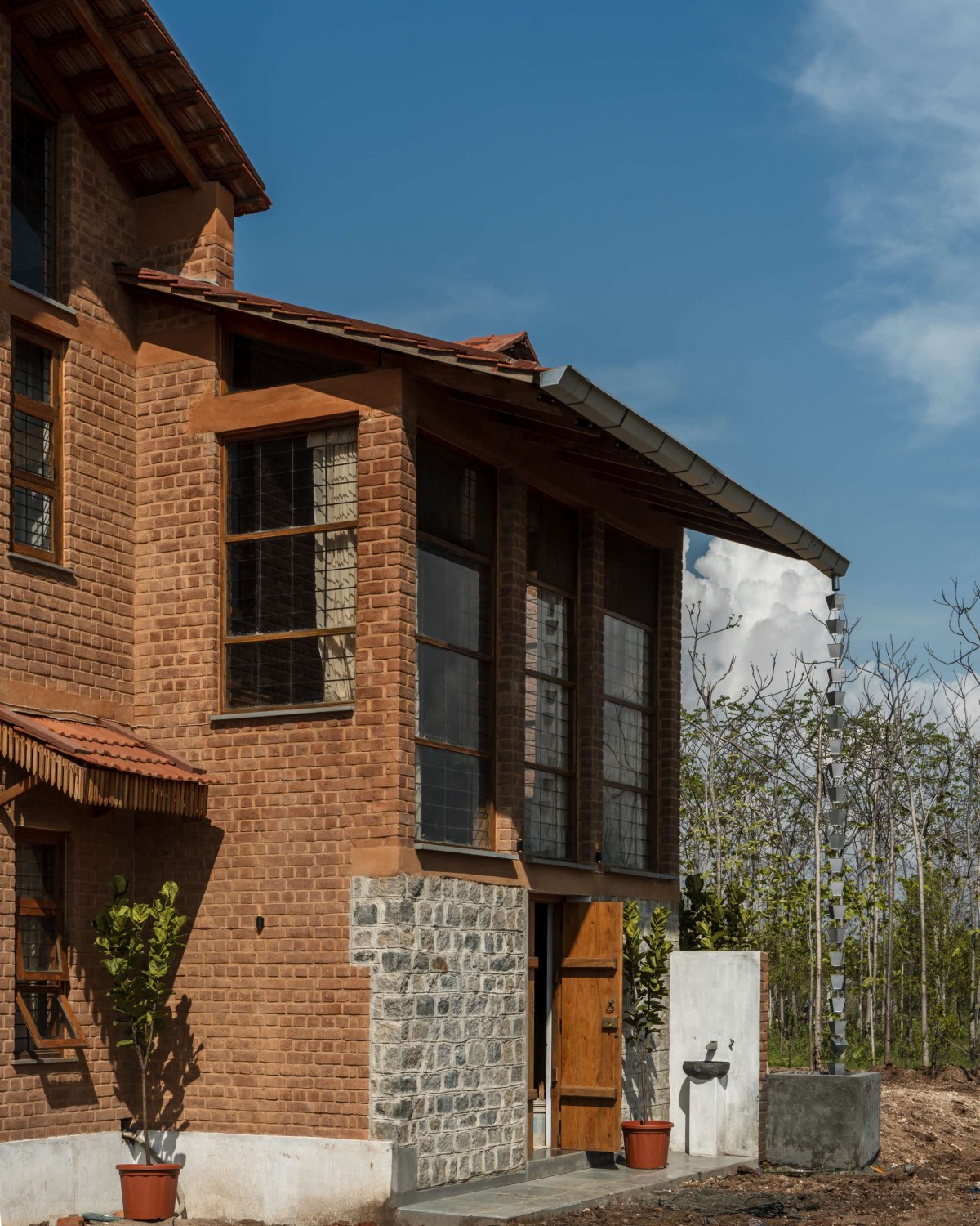 Exterior view of Brick Manor by Bhutha Earthen Architecture Studio