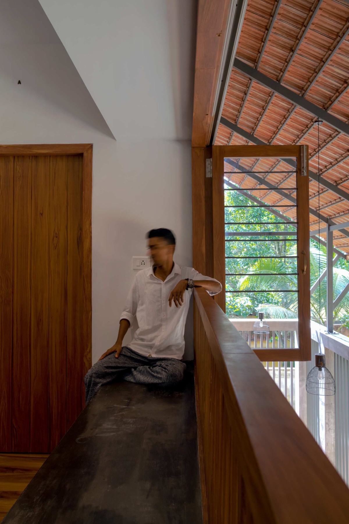 Seating area at first floor of Solo Roof  by Studio Acis