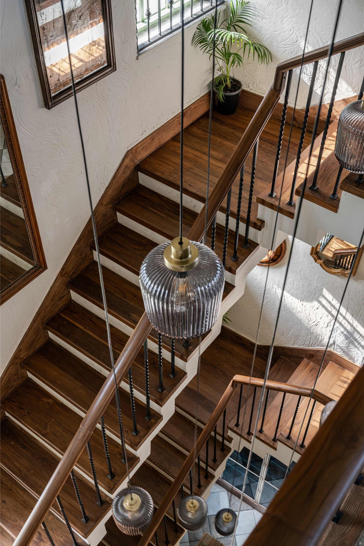 Staircase and Chandelier of Trezoro by Studio M Design