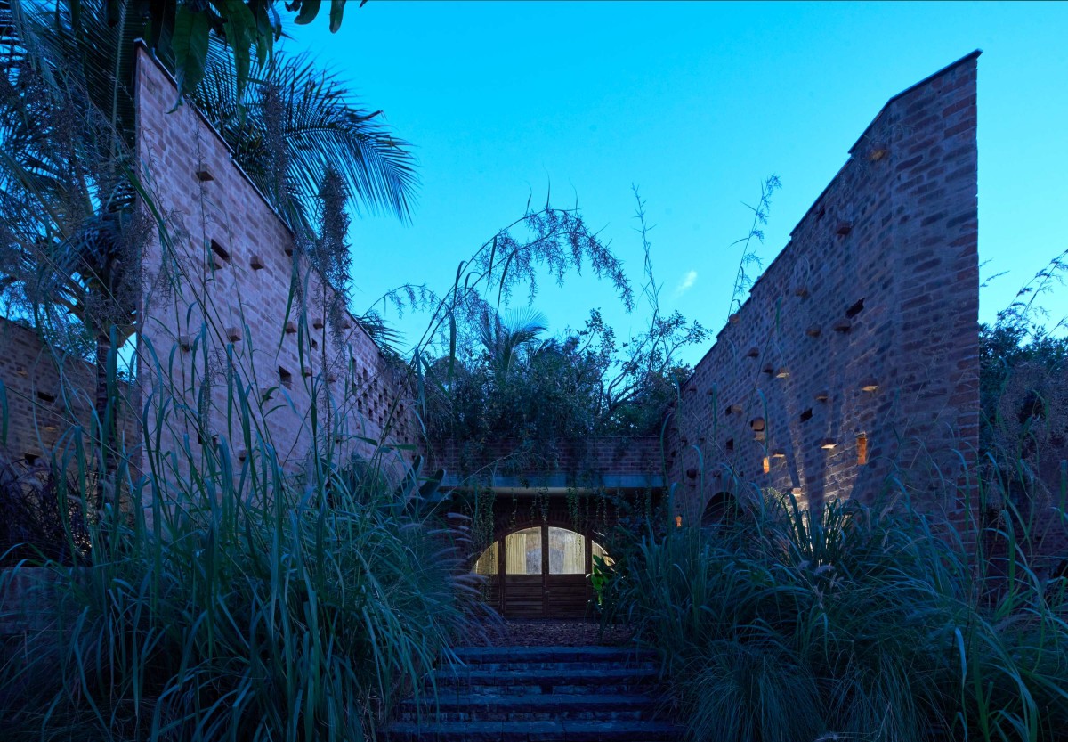 Dusk light exterior view of Subterranean Ruins by A Threshold