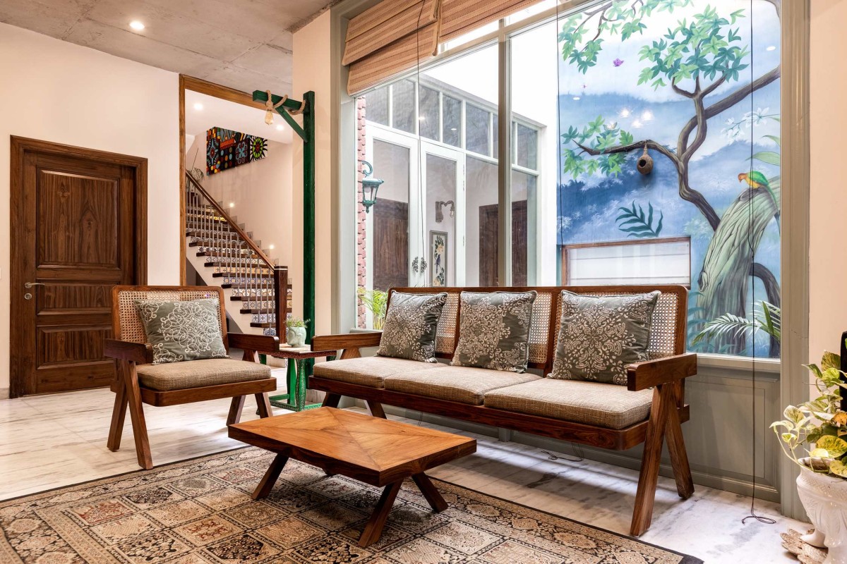 Family Living room of The Tapered House by Studio Mohenjodaro