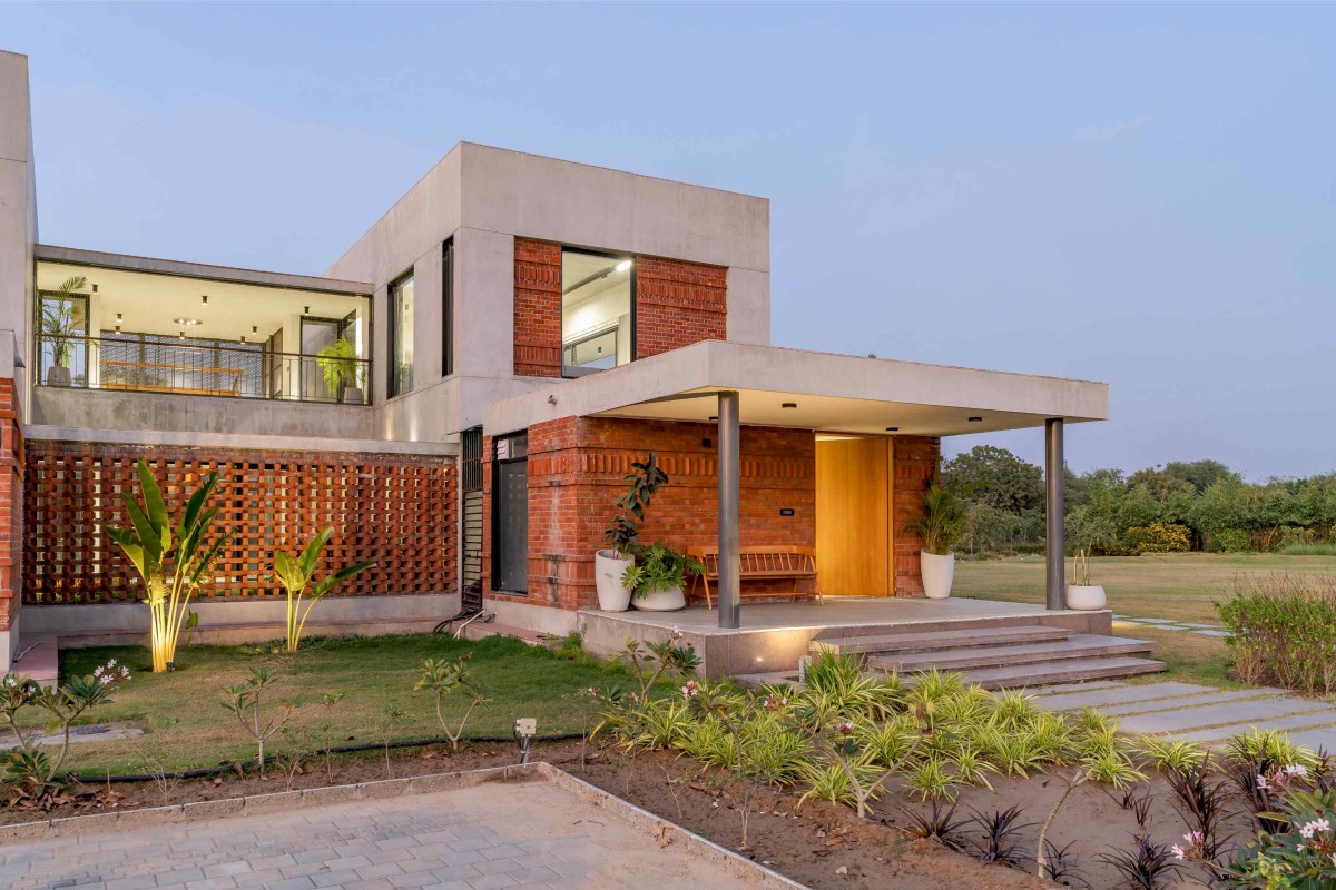 Dusk light exterior view of Agrawal Farm by Urbscapes