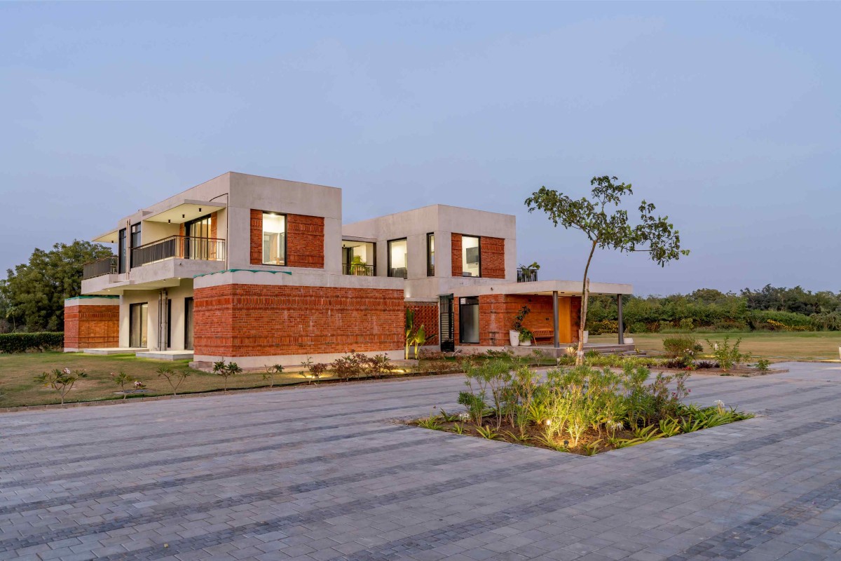 Dusk light exterior view of Agrawal Farm by Urbscapes