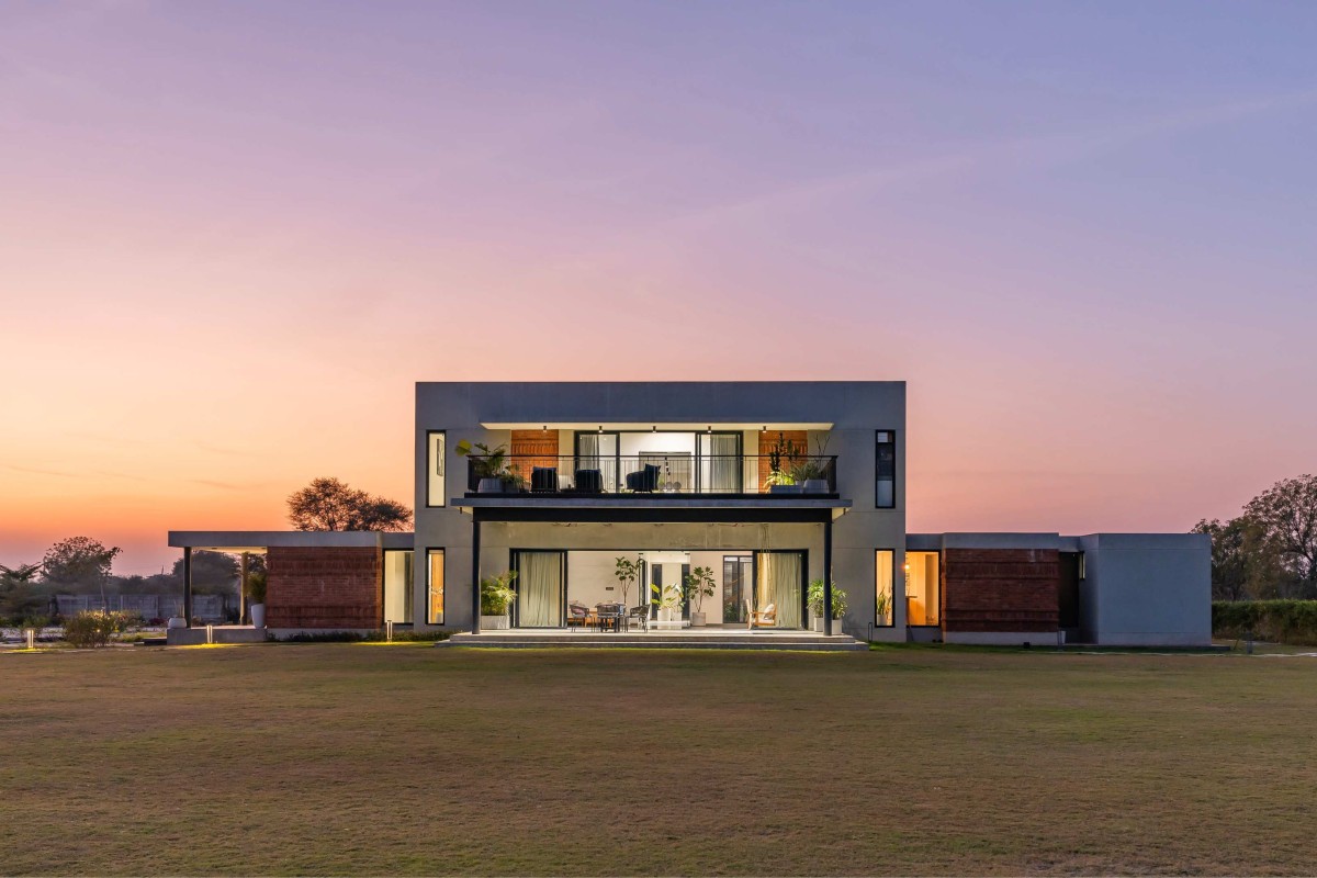 Dusk light exterior view of Agrawal Farm by Urbscapes