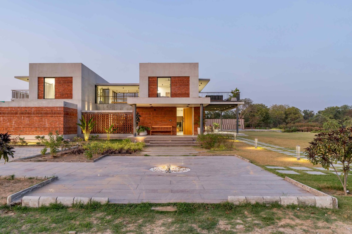 Dusk light exterior view of Agrawal Farm by Urbscapes