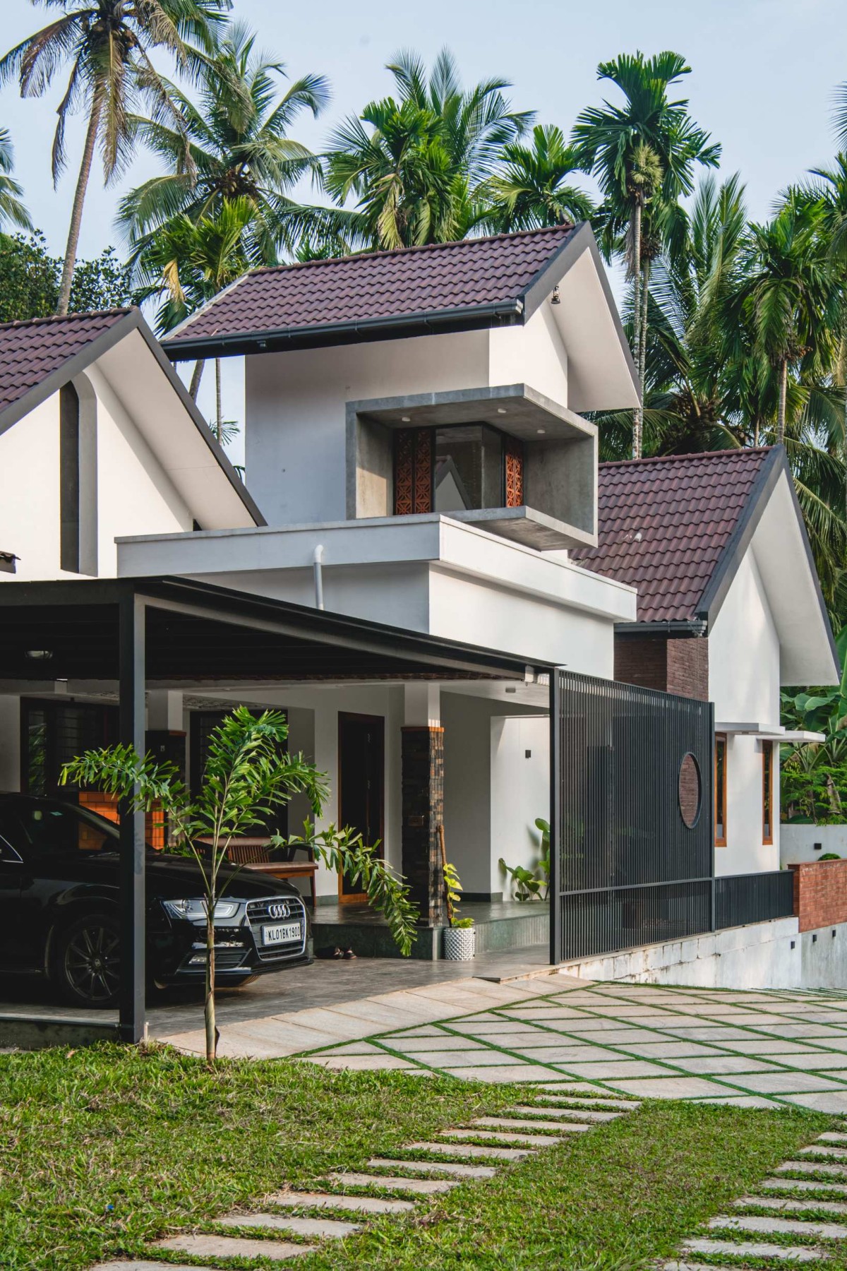 Porch and Parking area of Jannah by Urvi Architects