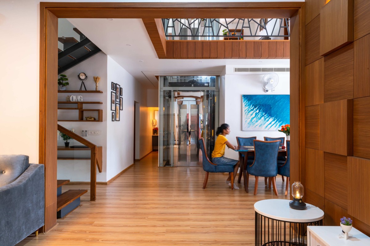 Passage from living to dining area of Kevin Villa by Nature's Craft Architecture Studio