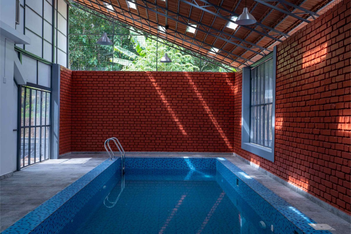 Pool view of Kevin Villa by Nature's Craft Architecture Studio