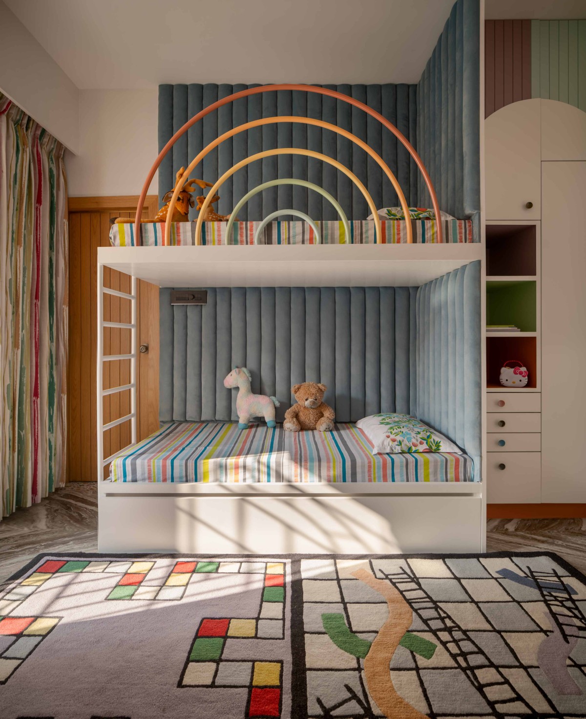 Double Decker bed for the kids bedroom with pastel colours and geometries