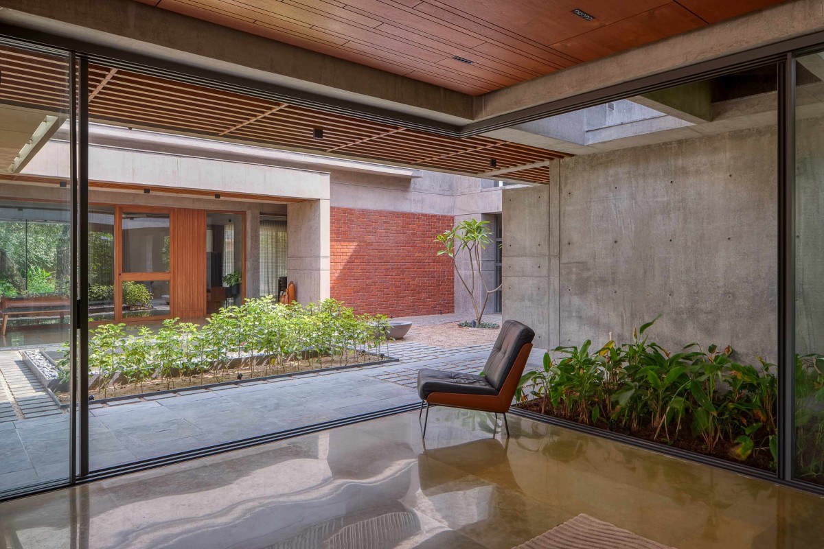 Passage to courtyard of The Courtyard House by Rushi Shah Architects + Tattva Landscapes