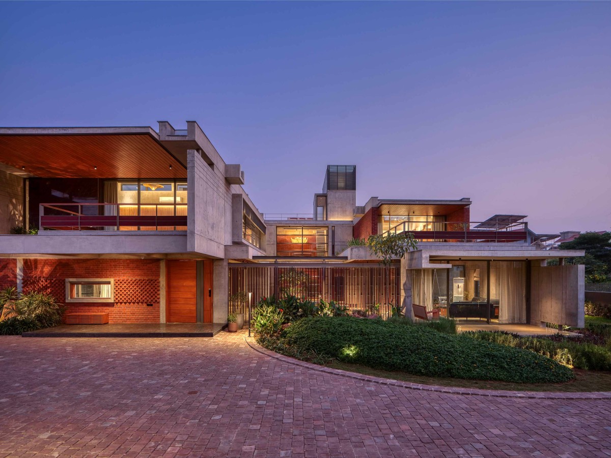 Dusk light exterior view of The Courtyard House by Rushi Shah Architects + Tattva Landscapes
