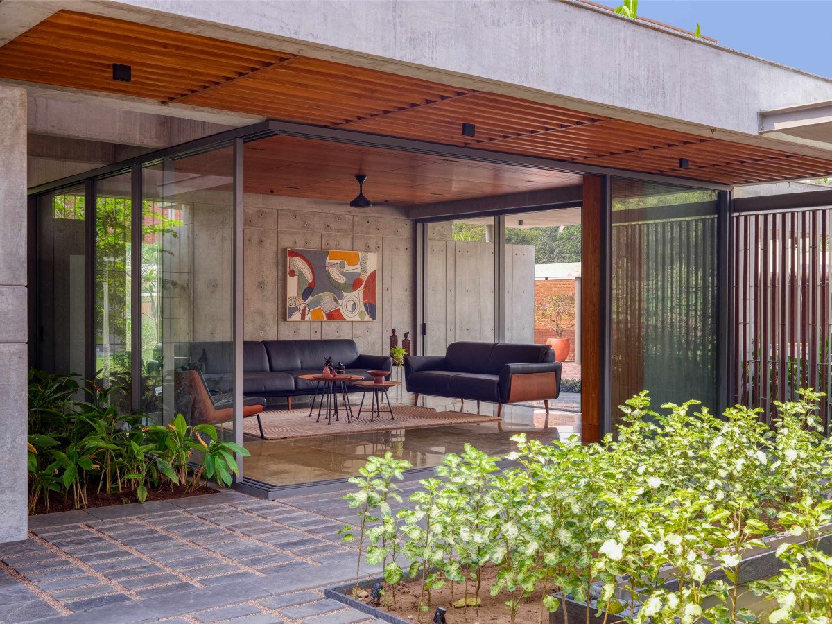 Courtyard to living room of The Courtyard House by Rushi Shah Architects + Tattva Landscapes