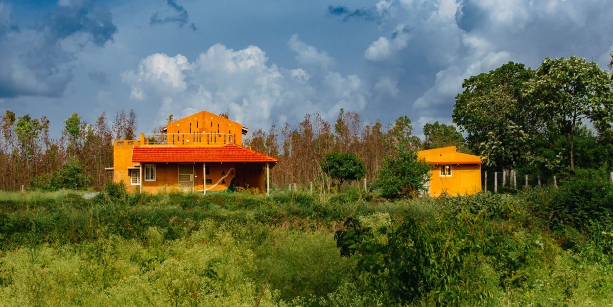 Exterior view of Composite Earth Farmhouse by Studio Verge