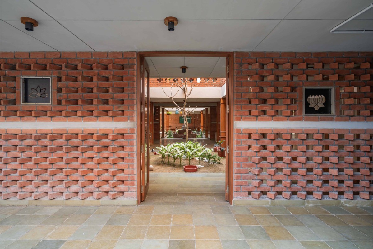 Passage to courtyard of The Maze House by MISA Architects