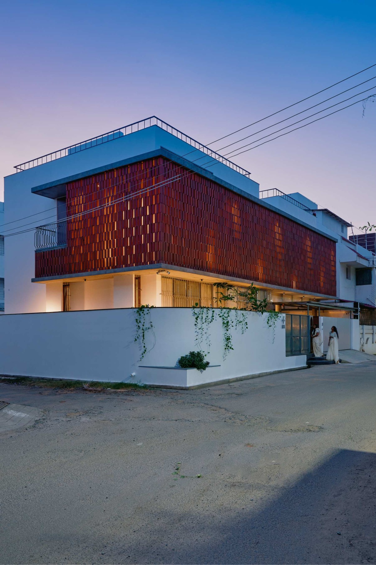Dusk light exterior view of House of Two Realities by STO.M.P