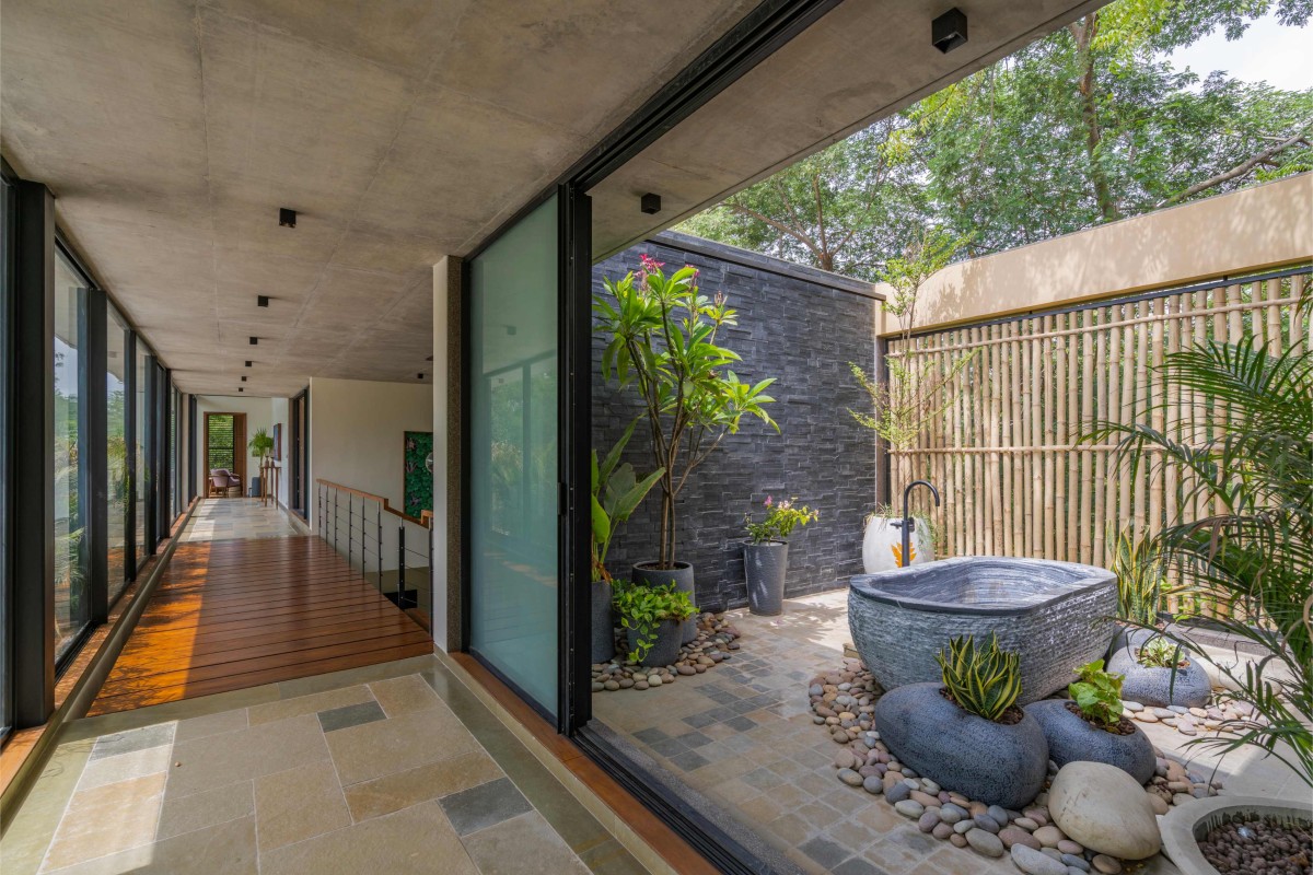 Passage to courtyard of Kalrav Villa by VPA Architects