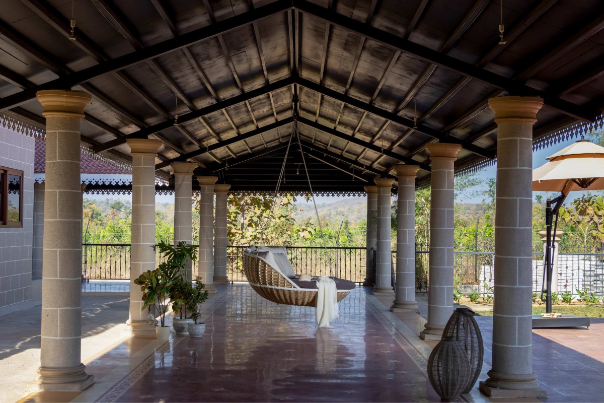 Outdoor swing at peripheral walkway of The Farmhouse by Oris Architects