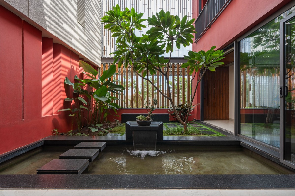 Central Courtyard view from Dining of The Red Courtyard House by Jacob + Rathodi Architects